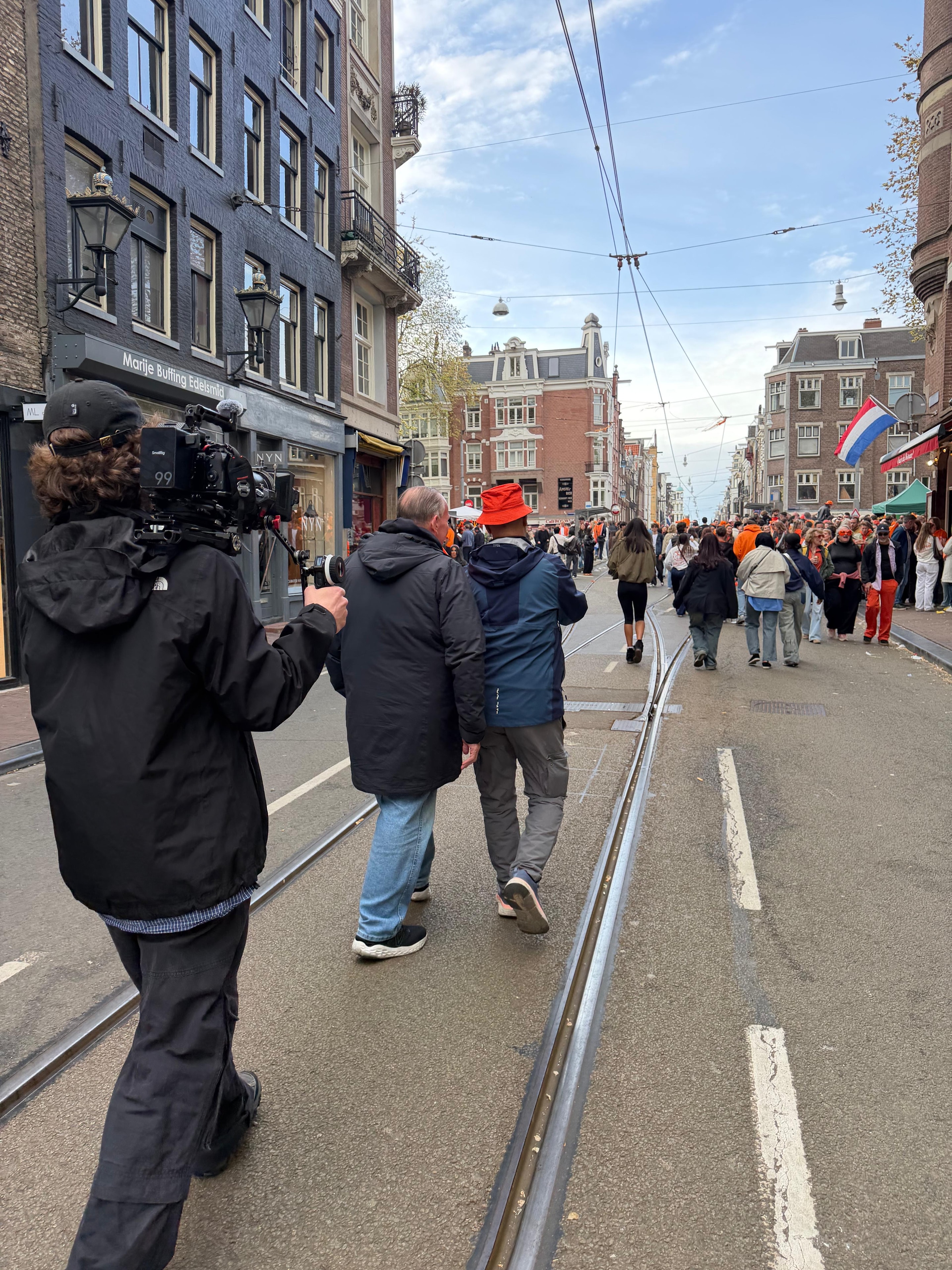 Documentary film crew filming on location in Amsterdam streets