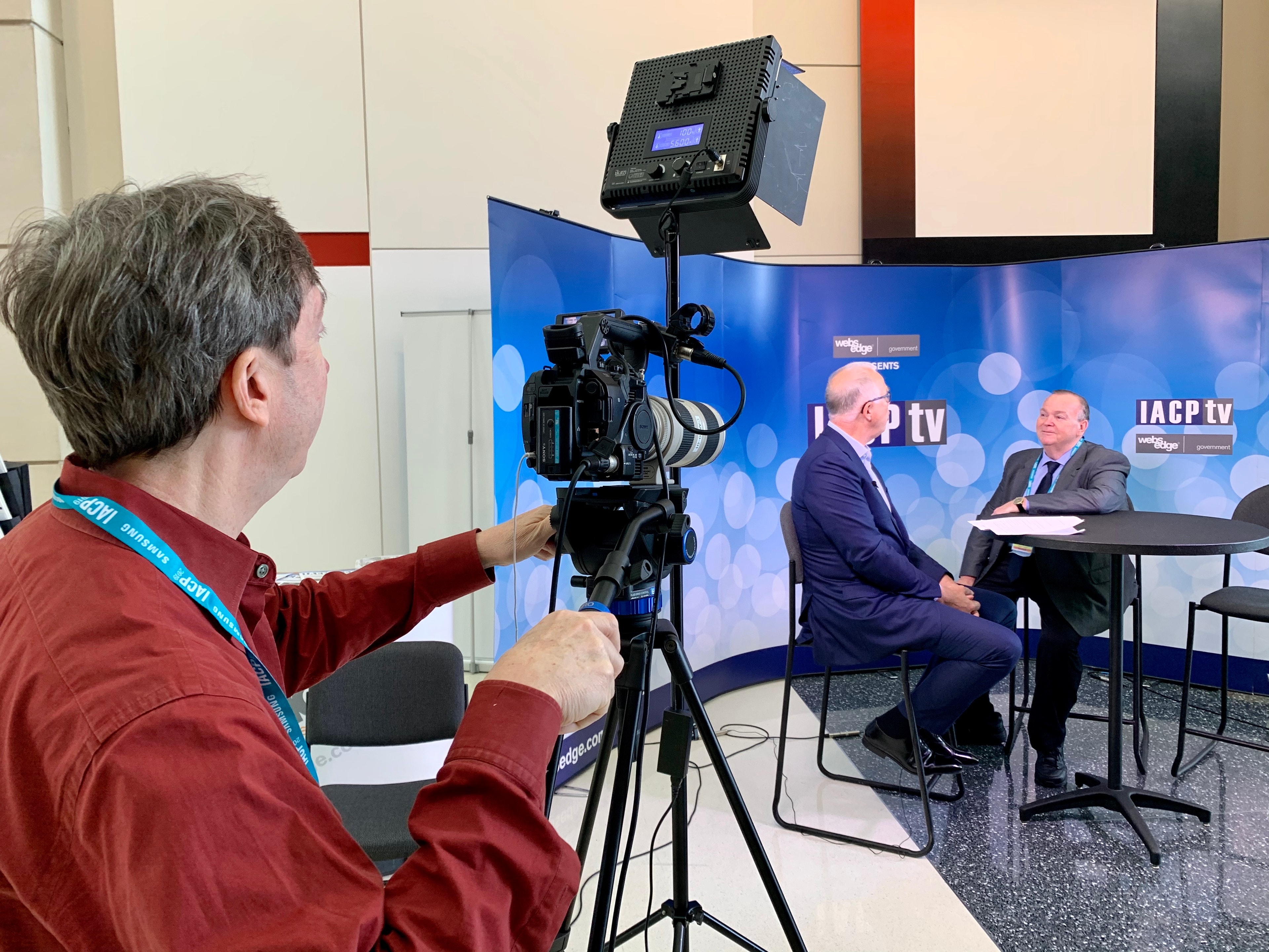 Mark Fallon being filmed for IACP TV at a professional studio setup