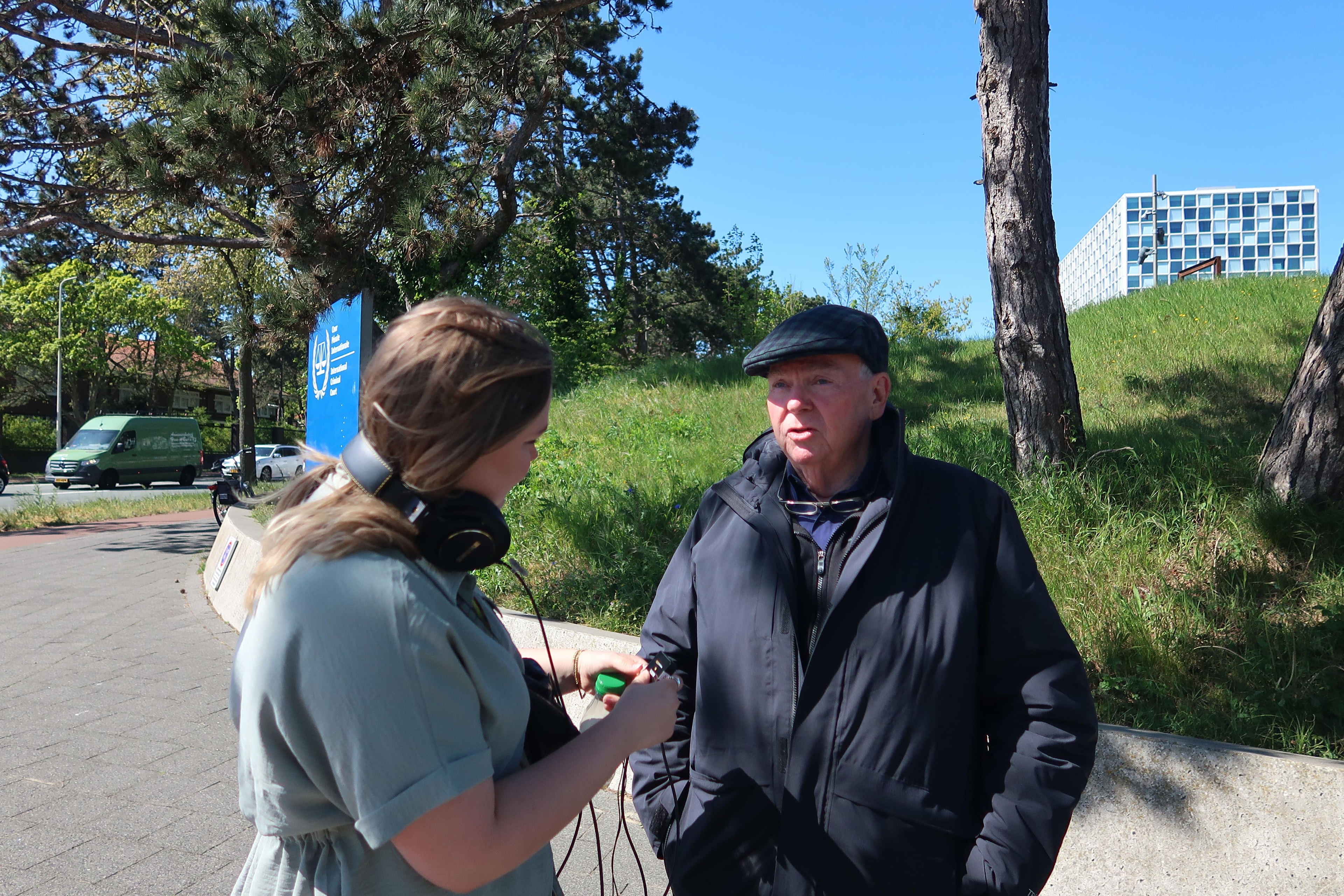 Mark Fallon being interviewed on location outside the International Criminal Court